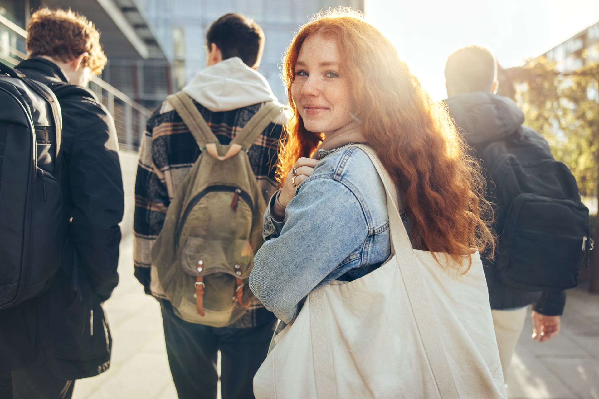 Girl looks over shoulder with red hair