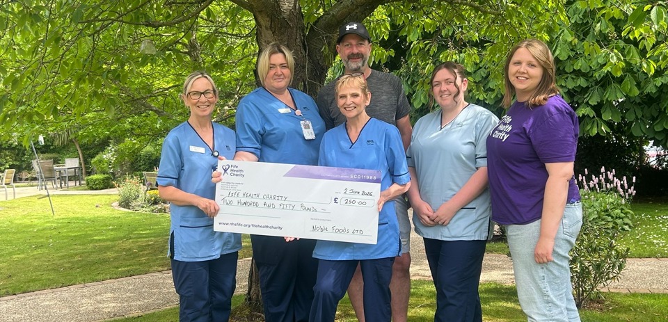 Alice With Team And Cheque